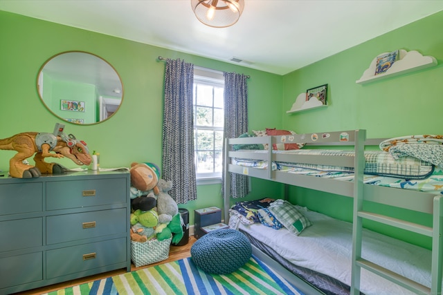 bedroom featuring wood finished floors