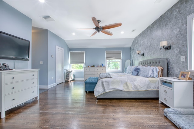 bedroom with an accent wall, baseboards, dark wood finished floors, ceiling fan, and recessed lighting