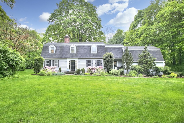 81 Grumman Hill Rd, Wilton, CT 06897 - dutch colonial featuring roof with shingles, a chimney, a front lawn, a gambrel roof, and view of scattered trees