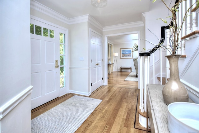 81 Grumman Hill Rd, Wilton, CT 06897 - entrance foyer featuring light wood-style flooring and crown molding