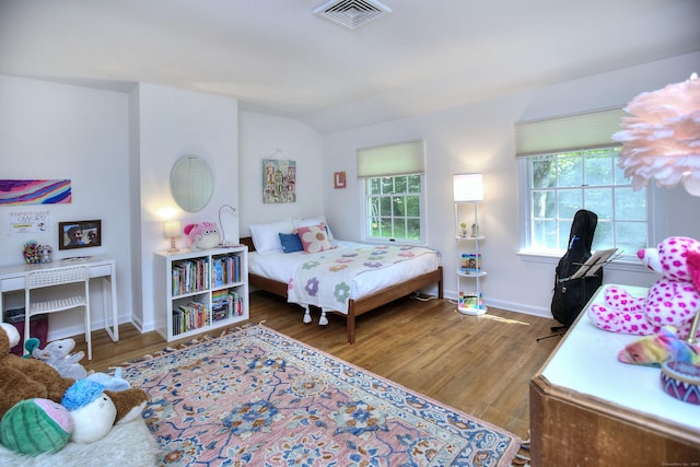 81 Grumman Hill Rd, Wilton, CT 06897 - bedroom with wood finished floors, vaulted ceiling, and baseboards