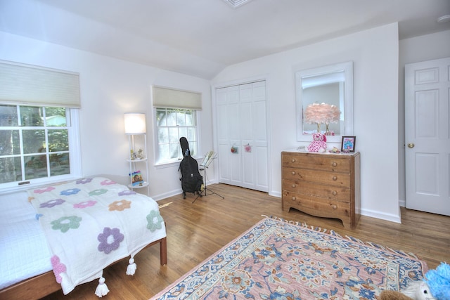 81 Grumman Hill Rd, Wilton, CT 06897 - bedroom featuring lofted ceiling, wood finished floors, baseboards, and a closet