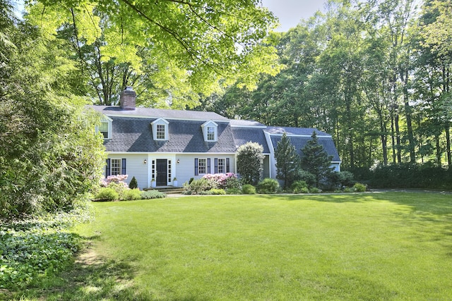 81 Grumman Hill Rd, Wilton, CT 06897 - colonial inspired home with a chimney, a front yard, roof with shingles, and a gambrel roof
