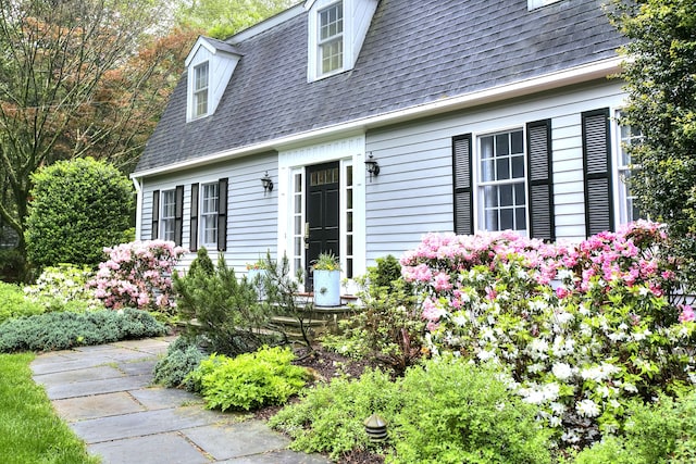 81 Grumman Hill Rd, Wilton, CT 06897 - property entrance featuring roof with shingles