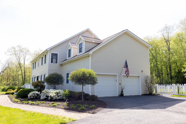70 Wakeman Hill Rd, Sherman, CT 06784 - view of side of home with fence, a garage, and asphalt driveway