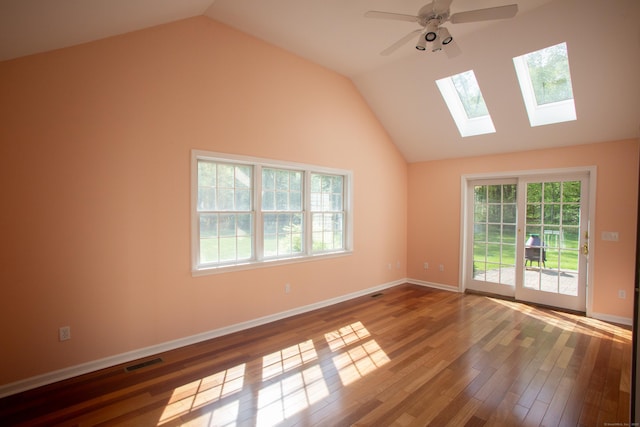 70 Wakeman Hill Rd, Sherman, CT 06784 - unfurnished room featuring a skylight, vaulted ceiling, wood finished floors, ceiling fan, and baseboards