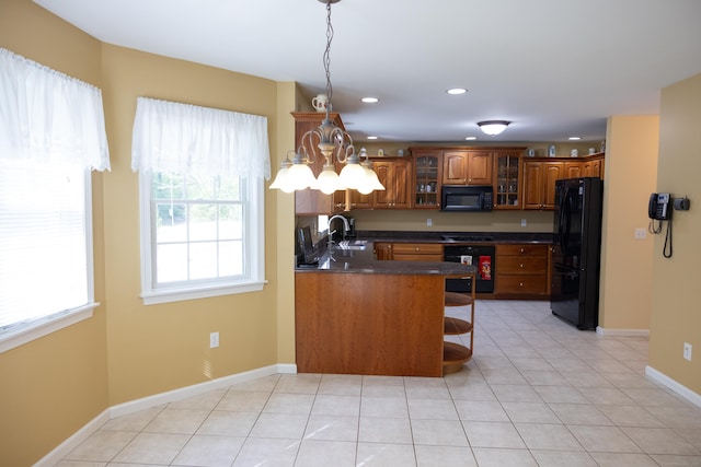70 Wakeman Hill Rd, Sherman, CT 06784 - kitchen featuring black appliances, dark countertops, brown cabinetry, recessed lighting, and glass insert cabinets