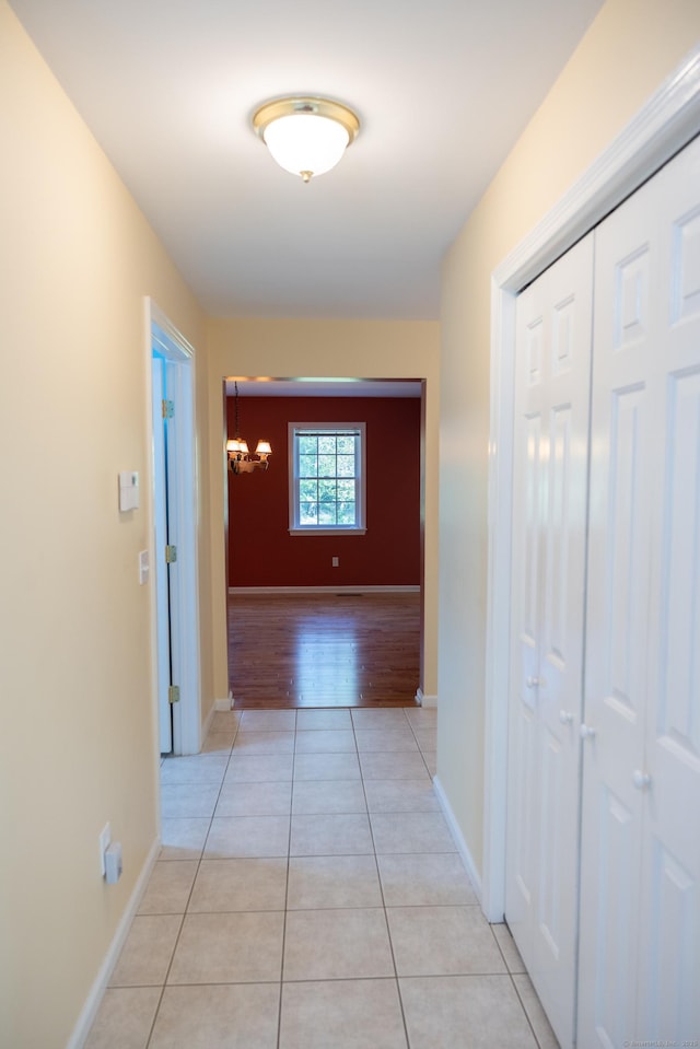 70 Wakeman Hill Rd, Sherman, CT 06784 - hall featuring a chandelier, light tile patterned floors, and baseboards