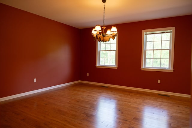 70 Wakeman Hill Rd, Sherman, CT 06784 - spare room with plenty of natural light, a chandelier, wood finished floors, and baseboards