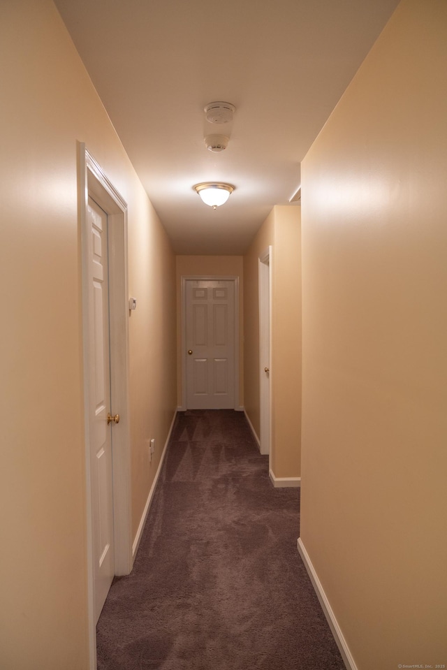 70 Wakeman Hill Rd, Sherman, CT 06784 - corridor featuring dark colored carpet and baseboards