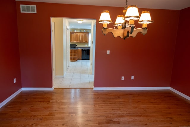 70 Wakeman Hill Rd, Sherman, CT 06784 - empty room with a chandelier, light wood-style flooring, and baseboards