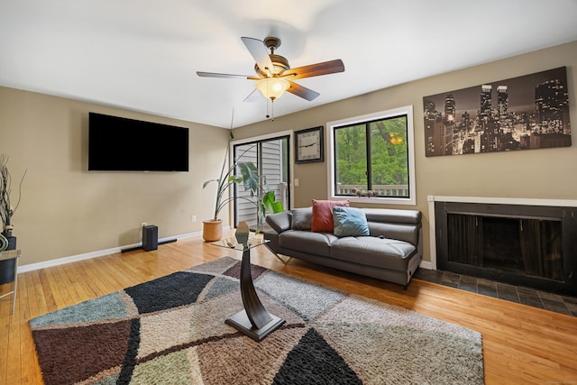 47 Currier Pl Unit 47, Cheshire, CT 06410 - living area featuring ceiling fan, wood finished floors, baseboards, and a fireplace with flush hearth