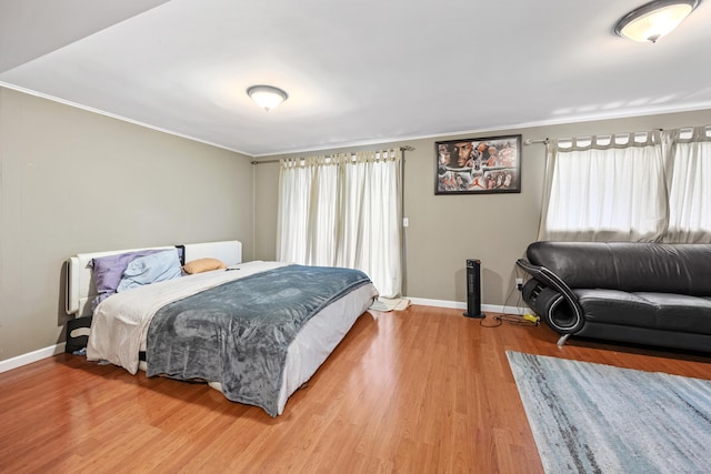 47 Currier Pl Unit 47, Cheshire, CT 06410 - bedroom featuring crown molding, baseboards, and light wood-type flooring