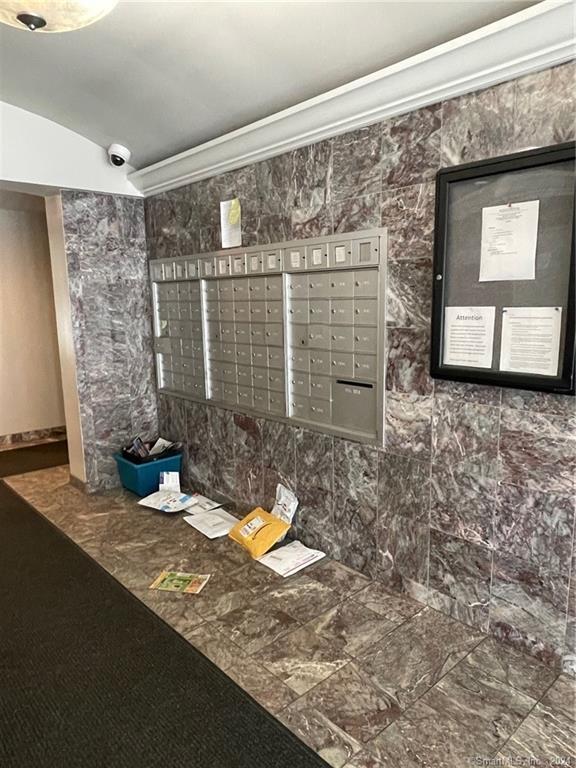 300 Broad St Unit 908, Stamford, CT 06902 - surrounding community with mail area, crown molding, and lofted ceiling