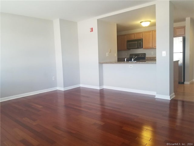 300 Broad St Unit 908, Stamford, CT 06902 - kitchen with stainless steel appliances, dark wood-style floors, a sink, and baseboards
