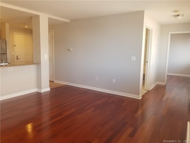 300 Broad St Unit 908, Stamford, CT 06902 - unfurnished living room with dark wood-type flooring and baseboards