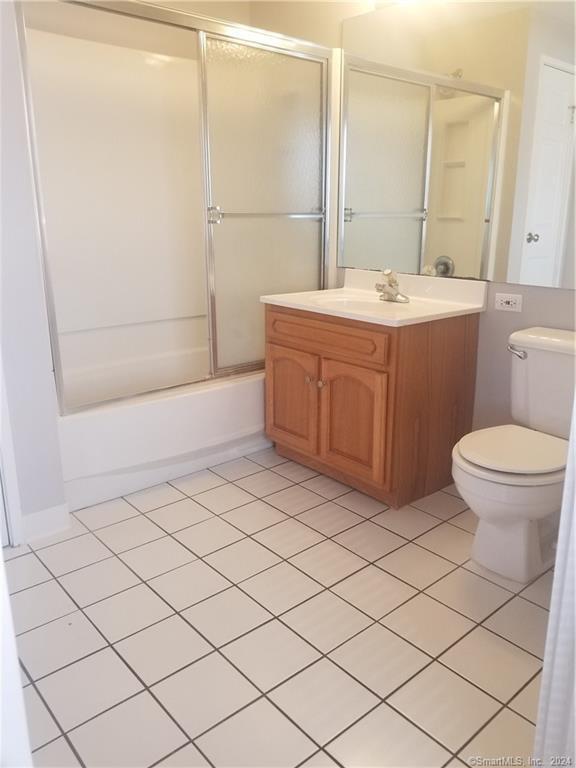 300 Broad St Unit 908, Stamford, CT 06902 - full bathroom with tile patterned flooring, vanity, toilet, and enclosed tub / shower combo