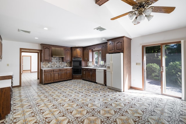 48 Lafayette Dr, Trumbull, CT 06611 - kitchen with white appliances, tasteful backsplash, light countertops, ceiling fan, and dark brown cabinetry