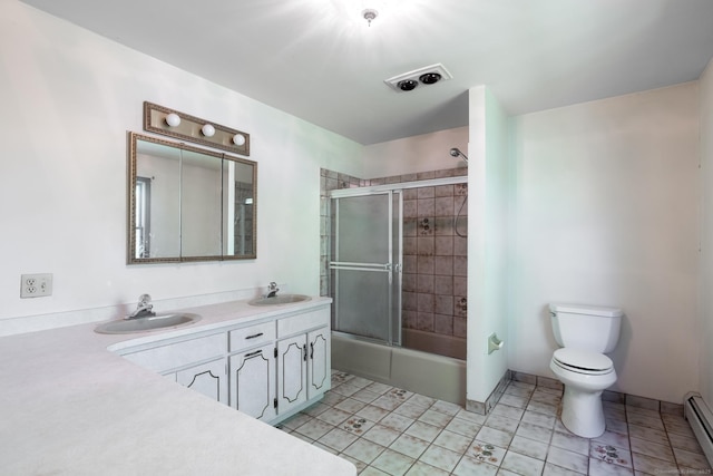 48 Lafayette Dr, Trumbull, CT 06611 - bathroom featuring baseboard heating, toilet, double vanity, combined bath / shower with glass door, and tile patterned flooring