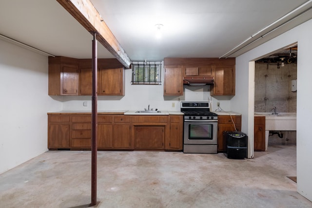 48 Lafayette Dr, Trumbull, CT 06611 - kitchen with stainless steel gas range, concrete floors, brown cabinets, and under cabinet range hood