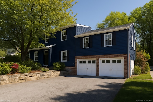 48 Lafayette Dr, Trumbull, CT 06611 - view of front of home featuring an attached garage, driveway, and brick siding