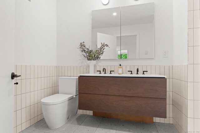 19 Old Paddock Ln, Kent, CT 06785 - bathroom featuring tile walls, vanity, wainscoting, and toilet