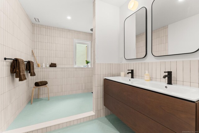 19 Old Paddock Ln, Kent, CT 06785 - full bathroom with double vanity, tile walls, and a shower