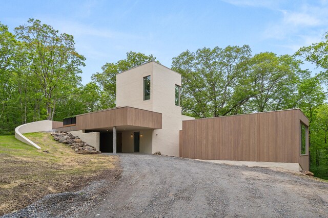 19 Old Paddock Ln, Kent, CT 06785 - view of side of property featuring dirt driveway and stucco siding