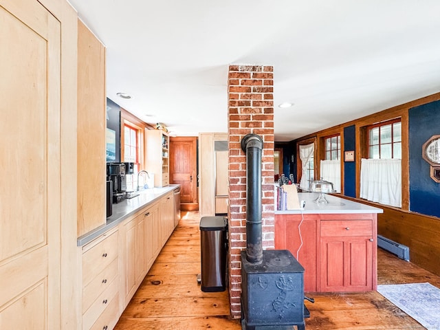 101 Child Hill Rd, Woodstock, CT 06281 - kitchen with a wood stove, light wood finished floors, a baseboard heating unit, built in refrigerator, and recessed lighting