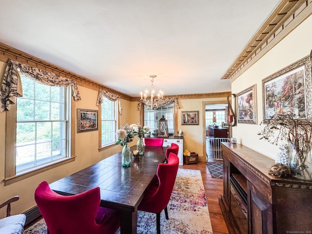 101 Child Hill Rd, Woodstock, CT 06281 - dining space featuring a chandelier, plenty of natural light, dark wood-style floors, and ornamental molding