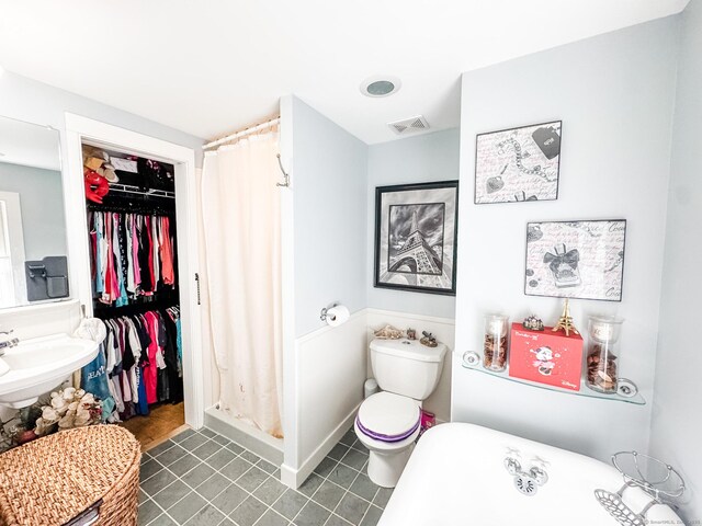 101 Child Hill Rd, Woodstock, CT 06281 - bathroom featuring a freestanding bath, a shower stall, tile patterned floors, toilet, and a sink