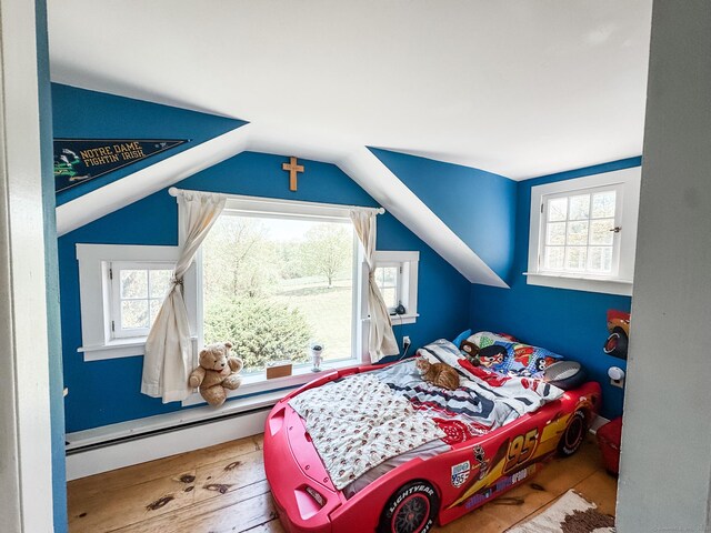 101 Child Hill Rd, Woodstock, CT 06281 - bedroom featuring a baseboard heating unit, vaulted ceiling, and hardwood / wood-style flooring