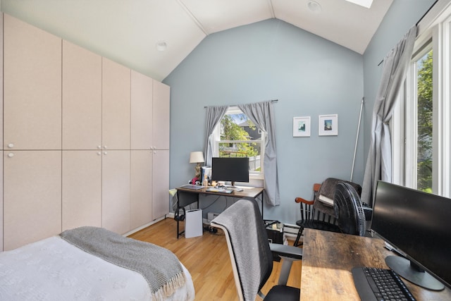 101 White Ave, West Hartford, CT 06119 - bedroom with light wood finished floors, an office area, and high vaulted ceiling