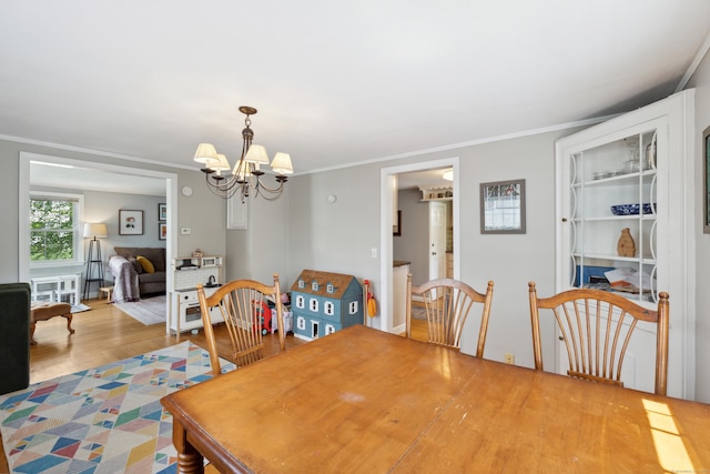 101 White Ave, West Hartford, CT 06119 - dining space featuring a chandelier, wood finished floors, and ornamental molding