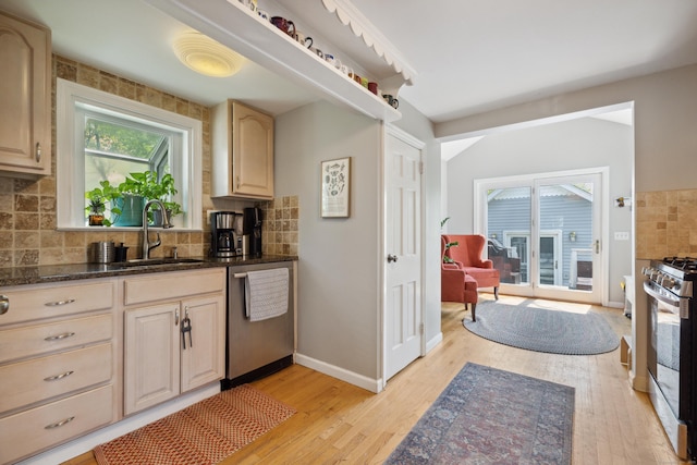 101 White Ave, West Hartford, CT 06119 - kitchen featuring a sink, stainless steel appliances, light wood finished floors, and decorative backsplash