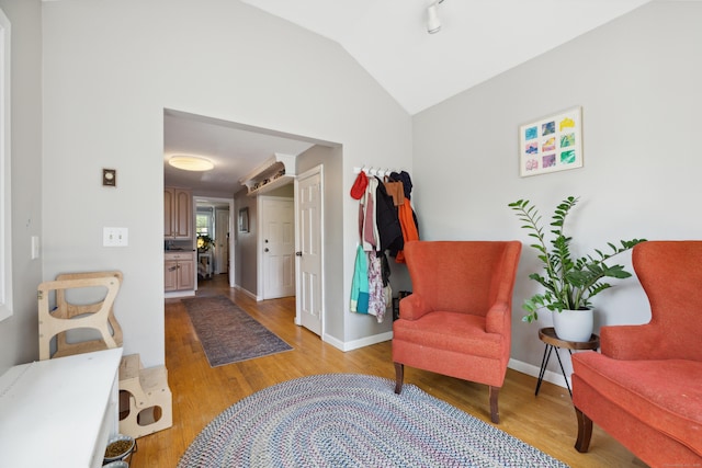 101 White Ave, West Hartford, CT 06119 - living area featuring light wood-style flooring, lofted ceiling, and baseboards