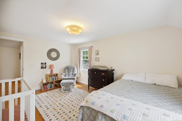 101 White Ave, West Hartford, CT 06119 - bedroom with wood finished floors, vaulted ceiling, and baseboards