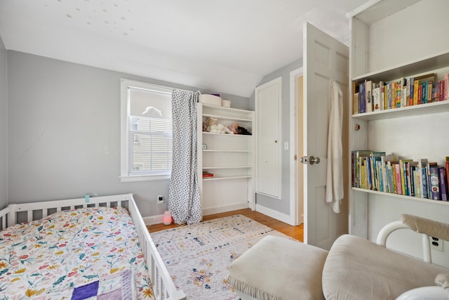 101 White Ave, West Hartford, CT 06119 - bedroom with lofted ceiling, wood finished floors, and baseboards