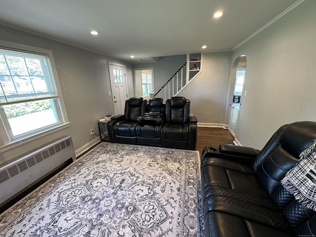 794 Center St, Manchester, CT 06040 - living area featuring radiator heating unit, arched walkways, recessed lighting, healthy amount of natural light, and baseboards
