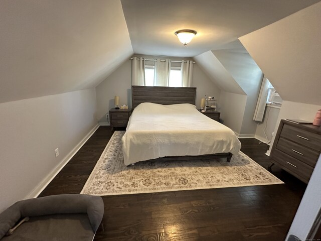 794 Center St, Manchester, CT 06040 - bedroom with dark wood finished floors, vaulted ceiling, and baseboards