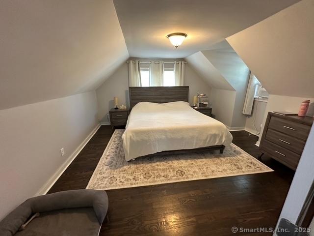 794 Center St, Manchester, CT 06040 - bedroom featuring lofted ceiling, baseboards, and dark wood-style flooring
