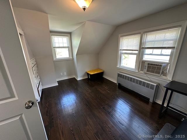 794 Center St, Manchester, CT 06040 - bonus room with radiator, wood finished floors, lofted ceiling, and baseboards