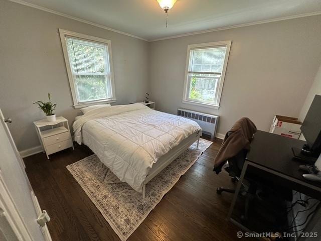 794 Center St, Manchester, CT 06040 - bedroom with radiator heating unit, multiple windows, dark wood-style flooring, and ornamental molding