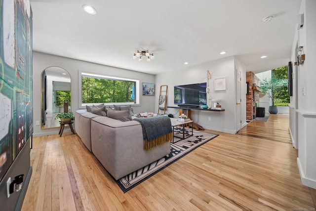 31 Poverty Hollow Rd, Newtown, CT 06470 - living room with healthy amount of natural light, light wood-type flooring, recessed lighting, baseboards, and arched walkways