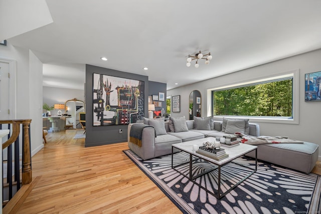 31 Poverty Hollow Rd, Newtown, CT 06470 - living area featuring arched walkways, light wood-style flooring, and recessed lighting