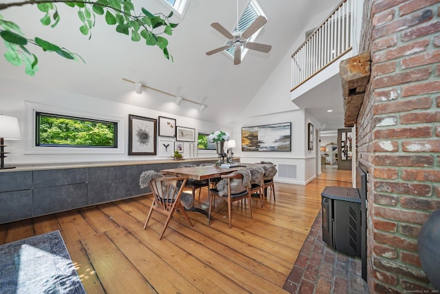 31 Poverty Hollow Rd, Newtown, CT 06470 - dining space featuring rail lighting, wood-type flooring, a ceiling fan, and high vaulted ceiling