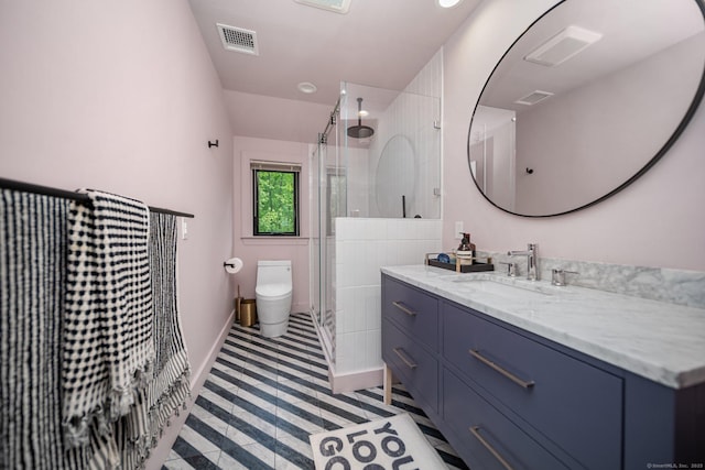 31 Poverty Hollow Rd, Newtown, CT 06470 - full bathroom featuring vanity, a shower stall, toilet, baseboards, and tile patterned floors