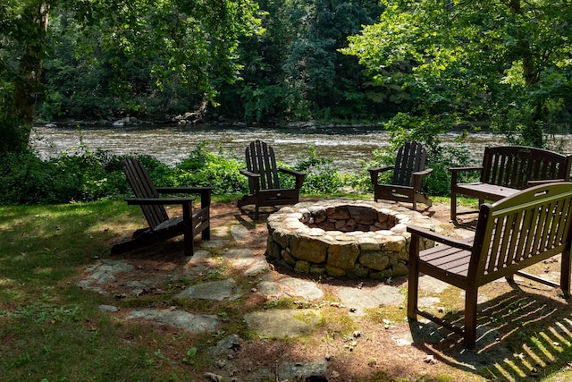 20 Kirk Rd, Sharon, CT 06796 - view of patio / terrace with a fire pit, a water view, and a wooded view