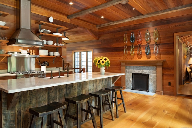 20 Kirk Rd, Sharon, CT 06796 - kitchen with extractor fan, wooden ceiling, wooden walls, light wood-type flooring, and a sink
