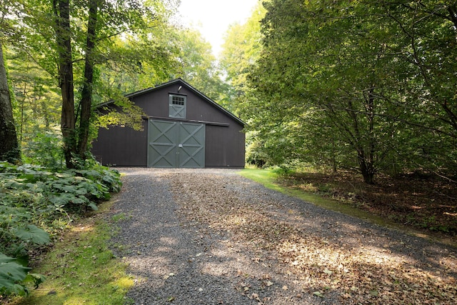 20 Kirk Rd, Sharon, CT 06796 - garage featuring a view of trees